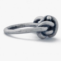 Cool knotted ring by Maison Martin Margiela. Made entirely of brass in Italy.