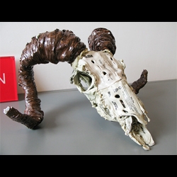 brian dettmer's book sculptures have been featured before.  but i just had to draw attention to this ram skull sculpture. 