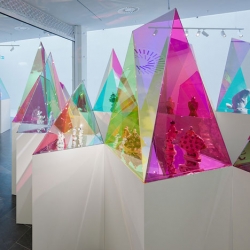 New York architects SO-IL have designed these coloured acrylic display cases in geometric shapes to showcase pieces by German porcelain brand Meissen in an exhibition at Kunsthal KAdE in Amersfoort, the Netherlands. 