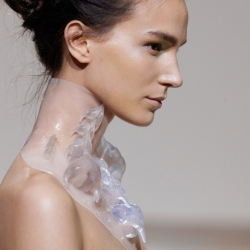 Spiny translucent 3D-printed collars were paired with magnetic dresses and shoes that looks like tree roots in Dutch fashion designer Iris van Herpen's latest haute couture collection.
