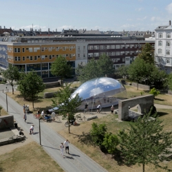 An inflatable pavilion that looks like a soap bubble, by architects Plastique Fantastique, has been popping up around Copenhagen.