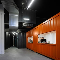 Funny offices with industrial containers, for Dinahosting, by Quinteiro+Maio, in Spain