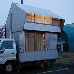 Unique customized camper with a hydraulic lift system to create a second-story Japanese-style zen loft space complete with rice paper windows and tatami mats.