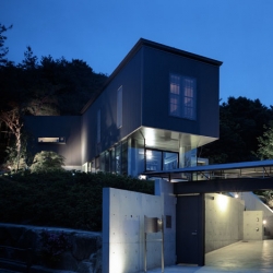 Stunning house by Masato Sekiya is elevated to fit its site in Ashiya, Japan.