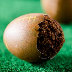It looks like a football - that is made of an egg - that is really filled with chocolate cake over at the Cupcake Project.