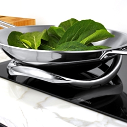 The Electrolux E:Motion Trivet provides induction through a curved surface, allowing for traditional Asian wok cooking on flat induction cook tops.