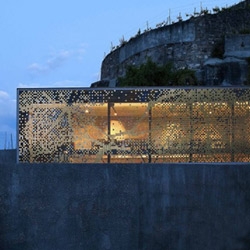This tasting bar for a winery in Switzerland has an amazing 'woven' facade made to look like a pixelated grape leaf! It's by Atelier Daniel Schlaepfer. 