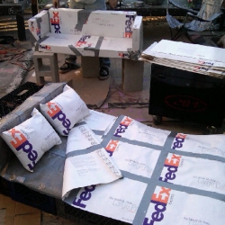 Check out the FedEx furniture design on the set of One Block Radius' music video.
