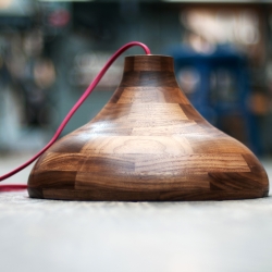 GWB walnut pendent lamp turned on a lathe. Turn it over to reveal its golden inside!