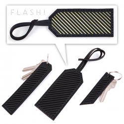 Flash it! Our NOTCOT In Plain Sight Collection of handmade (by me!) leather key chains and bag tags with subtle reflective stripes that POP when you flash them! 