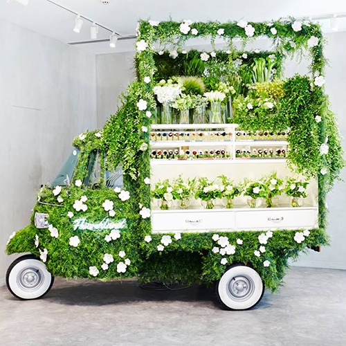 "A Piaggio Ape Covered in Green and Converted Into a Flower Shop" on Spoon & Tamago. This adorable setup is selling flowers at the Ginza flagship store of Italian luxury brand Fendi.