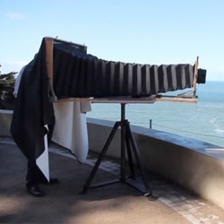 Darren Samuelson built this gigantic ultra-large format camera that take photos on 14"x36" X-Ray film. It is captured in this video by Matthew Sultan.