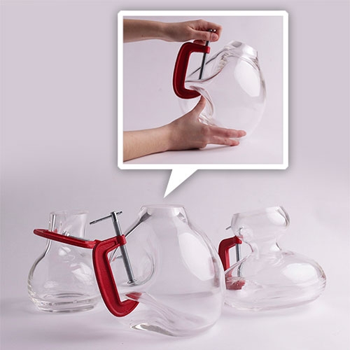 Força by João Xará. Beautifully delicate balance between blown glass and metal C-clamps.