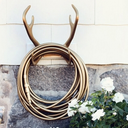 Sweden's Garden Glory - The Reindeer Wallmount and the Gold Digger hose are the perfect unexpected bling for any yard... (also in an assortment of other colors).