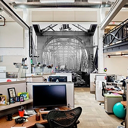 Google's Pittsburgh office by Strada is a fun conversion of a former Nabisco bakery that includes a hanging cargo net hammock, indoor bamboo forest (complete with water falls) and LEED gold certification.