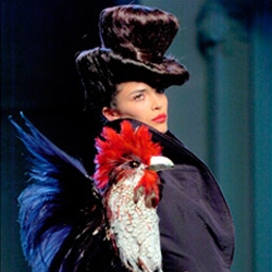 Runway shows often get creative with the styling, but this was a first for me, and check out the rooster on her sleeve too... more from Gaultier...