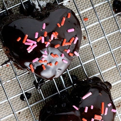On valentine's delights, Brownies For Dinner creates heart shaped chocolate and sprinkles covered whoopie pies ~ i had no idea "Whoopie pies are an Amish tradition, originally called hucklebucks."