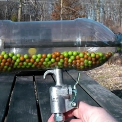 A homemade Airsoft machine gun using a soda bottle. It only costs $15 and requires 4 commonly available parts, plus pellets of course.