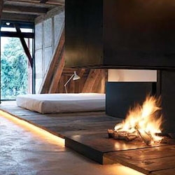 Vorstadt 14, located in a 15th-century house in the town of Zug, Switzerland, offers three suites of radically different designs for rent. The room shown here is a rustic-meets-Swiss-modern apartment designed by Roger Stussi.