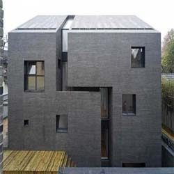 Simple and minimalist concrete house was designed by Chinese architect Atelier Zhanglei. All walls, roof and facade is made of concrete.