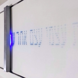 The Confession Machine prints online texts that fade away as time passes, just like the confession itself. It prints on a surface painted with UV sensitive pigment and flickers UV LEDs, temporarily writing sentences. 
