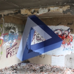 "Infinity Triangle" is a 3D triangle by Paper Donut and Justine Ricaud are representations in 2D on different walls.