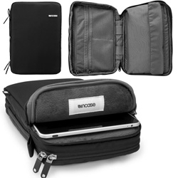 Incase's iPad Travel Kit Plus! A plushy sleeve for your ipad ~ and a zip open section for all your cables/keyboards/etc and even comes with a handy stand!