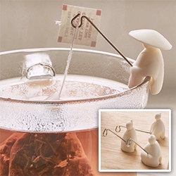 Fishermen Tea Bag Holder Set - made of silicone and metal.  It is based on the story of Jiang Taigong, who used a straight fishhook because he believed that fish would come to him when they were ready to be caught. 