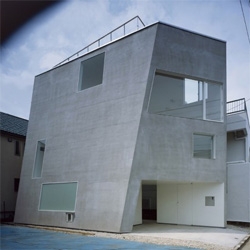 A leaning concrete house in Tokyo suburbs. Good design of interior spaces to get the most out of a small plot.