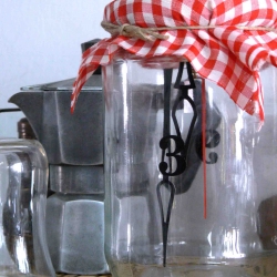 Clock in a jar inspired by childhood memories of capturing insects in a jar.  By Oren Hetrzronio.