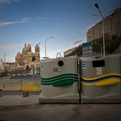 Photographer Jos Jansen takes a visual journey through Marseille's brand new recycling initiative which includes two giant bins (one green, one yellow) placed iconic all around the city.  
