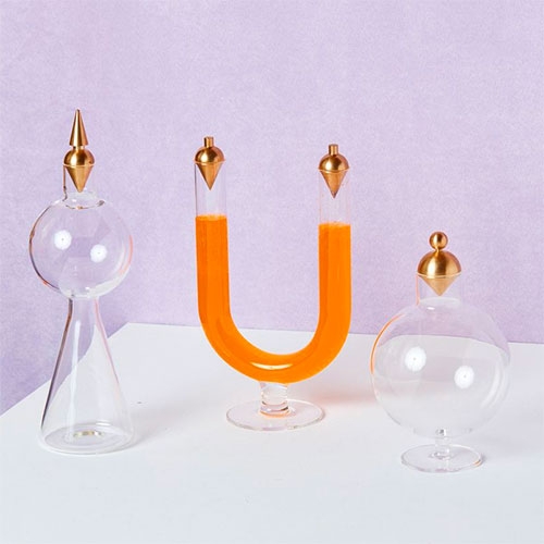 Anna Karlin Juliet Vessels. Borosilicate glass coupled with the solid brass stoppers (and dishwasher safe?!?!)