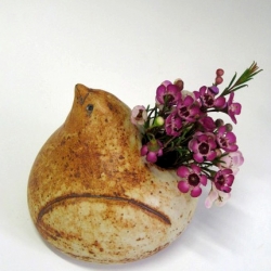 Spring has sprung and what better way to celebrate than to display a handmade high fired stoneware bird. Each piece is one of a kind! Measures approx. 3 1/2" and has a hole in the back for flowers.