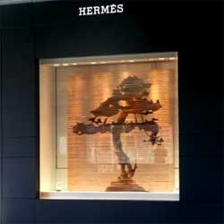 Beautiful sculpture window display by Kylie Stillman made from 240 sheets of plywood for Hermes Sydney.