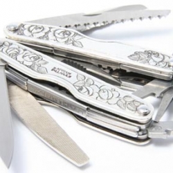 The Uber silver laden Leatherman. Never to be used for actual work, but a great piece of art. Adrian is a genius!