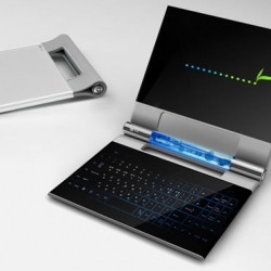 LG's new concept laptop using edge to edge OLED displays for both the keyboard and display, and blue methanol liquid fuel in a transparent cylindrical hinge.