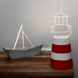 Sturlesi Design's Lighthouse and Boat lights - made of concrete, laser engraved acrylic, and LEDs.