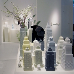 Metropolis is showcased by Lladró Atelier, under the guidance of Jaime Hayón.  Vases, lamps, mirrors and boxes, all take on the shapes of buildings, forming a metropolis of functional objects.