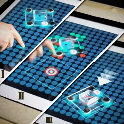 Media Computing Group's  'Madgets' (Actuating Widgets on Interactive Tabletops). Madgets are magnetic widgets for interactive tabletops... capable of automated movement / inductive charging.