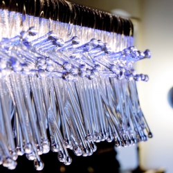 Madrid by Mawa Design is a frosty looking pendant lamp. Over 200 unique glass-pieces break the light in various ways, the blue LEDs make it look like ice.