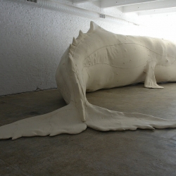 Mocha Dick, the 52-foot albino whale sculpture, lies in happy repose in his skin of wool felt and vinyl coated fabric. The material and textural details...