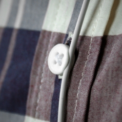 This 3D printed button not only holds your shirt together, but also holds the cord for your ear buds to keep them in your ears. 