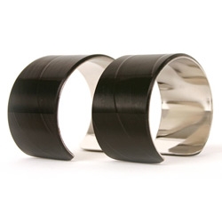 Fresh from Vinylux, the kings of cool in the world of recycled vinyl records.  These rockin' wrist cuffs have a platinum-type metal on the inside and 100% LP on the out.