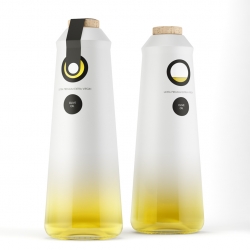 ""O" borns from the desire of making a ultra premium olive oil brand that could easily be used in luxury restaurants, hotels and special dinners, without shocking with the interiors, using a simple name ("O" from olive) and really simple but elegant graphics.

The logo is a "O" with a hole on the middle from where you can see the color of the olive oil. The bottle is made by glass and painted with a gradient from white to transparent.

On the bottom you can see the olive oil clearly, in a beautiful and interesting visual effect. The cap is made by cork, giving a traditional and "hand made" feeling to the product.