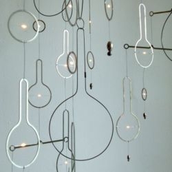 Sculptor Rodger Stevens and designer Mark McKenna created these flowing mobiles which embed elegant modern illumination into their design.