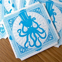 Mark Hoppus' Octopus logo ~ Octopus in a top hat letterpressed on a coaster... baseball cap and stickers!