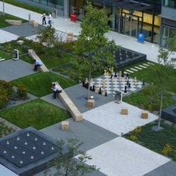 Cigler Marani Architects designed this courtyard park within a complex of office buildings in Prague. It's a patchwork of fun.