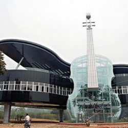 This violin and piano shaped building is located in the An Hui province of China. The glass violin contains an escalator, and the building contains city plans to showcase growth within the region. 