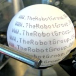 This spinning dot-matrix printer sprays inkjet messages on ping pong balls. Did I happen to mention that they're used as ammunition for a giant ping pong ball firing robot?