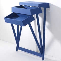 Pivot, by Shay Alkalay.   The coolest table on two legs! The drawers tilt open, instead of sliding out.